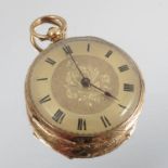 A fob watch, the engraved case stamped 'K18' with gilt metal cuvette,