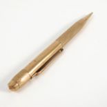 A 9ct gold propelling pencil, with engine turned bands,