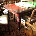 A Victorian mahogany extending dining table, with drop-in leaf, raised on four turned legs,