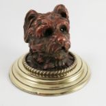 A 19th century novelty inkwell, formed as a shaggy haired dogs head, hinged through the jaw line,