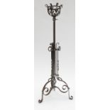 A 19th century torchere, with telescopic column supporting a bowl, raised on a tripod base,