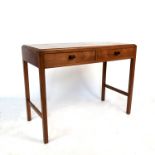 A two drawer Arts and Crafts side table, raised on four legs with end stretchers, width 35ins,