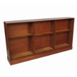 A 20th century hardwood triple fronted slightly bow front bookcase,
