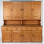 A Cotswold school oak sideboard,