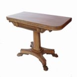 An early 19th century mahogany foldover card table,