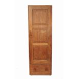 A wardrobe, with triple fielded panel door with drawer below, width 24.5ins, depth 73.