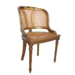 A cane seated gilt salon chair,