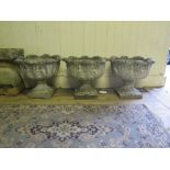 A Pair of Reconstituted Stone Garden Planters decorated with acanthus leaf