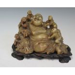 A Chinese Jadeite Hotei Laughing Buddha Group on hardwood base, c. 14 cm wide