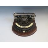 A Rare Hammond No.12 Typewriter with original cover, the baseboard with original plates including '