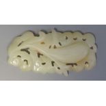 A Chinese Carved and Pierced Jade Ornament decorated with foliage, 7 cm
