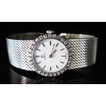 An Omega Lady's 18ct White Gold and Diamond Wristwatch with integral bracelet, 57.2 g
