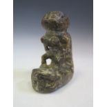 A Sierra Leone Carved Stone Nomoli or Pomdo Figure the male figure carved squatting with his