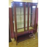 An Edwardian Mahogany and Marquetry Serpentine Glazed Display Cabinet