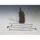 Four Sierra Leone Kissi Pennies and early carved wood and metal mounted powder flask