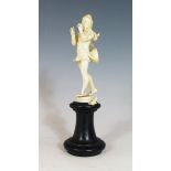 A Victorian Carved Ivory Figure of The Pied Piper of Hamlyn on ebonised base, 13.5 cm