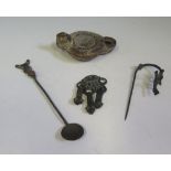 An Antique Bronze Ornamental Clothing Accessory cast with mask, cloak pin, terracotta oil lamp (