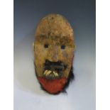 A Liberian Society Mask, possibly Poro, 22 cm. Given to the vendor 1960's