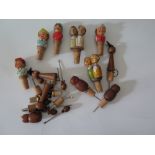 A Collection of German Carved Wooden Character Bottle Stoppers