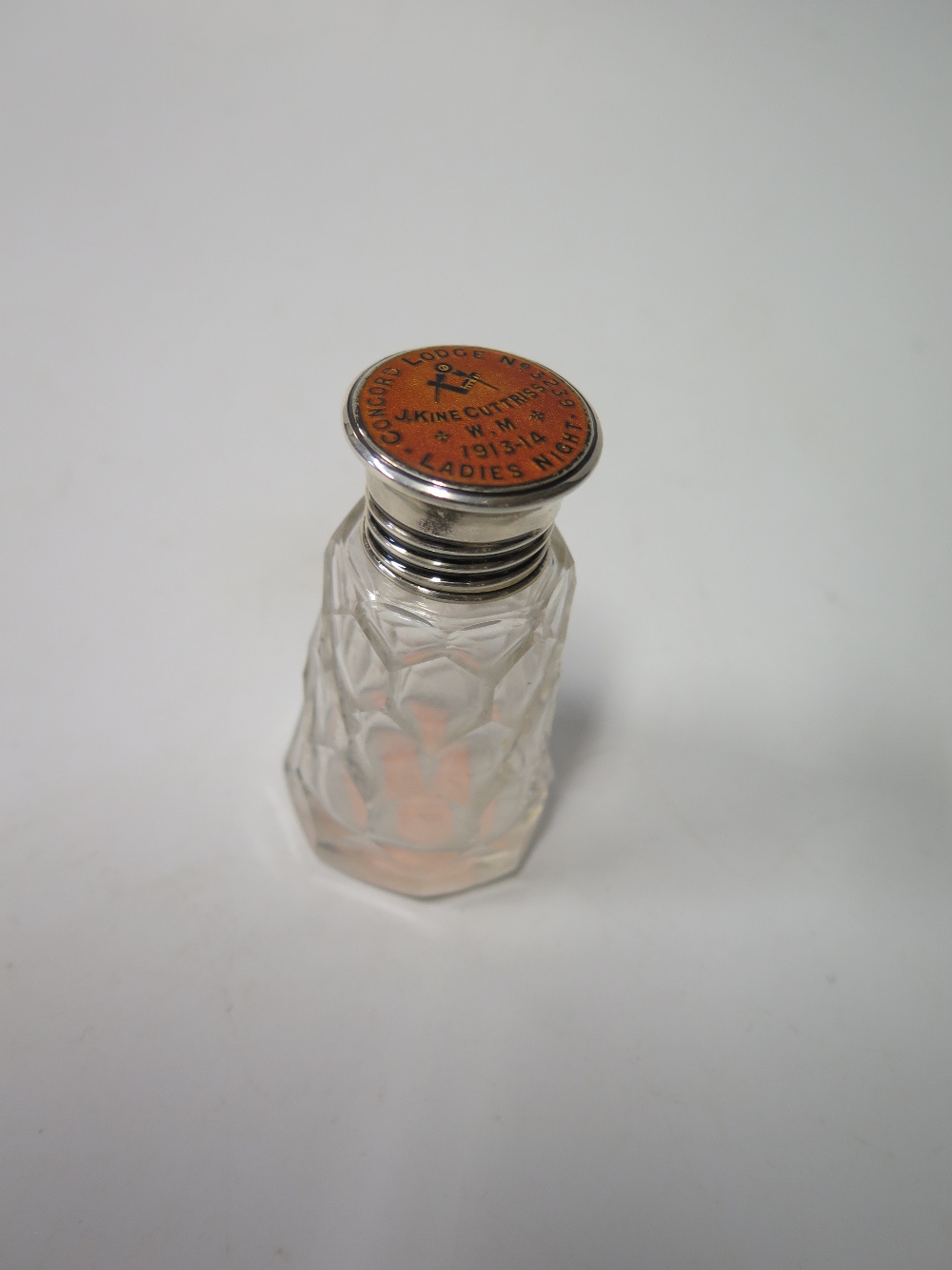A George V Masonic Silver Topped Cut Glass Scent Bottle, the enamelled top marked 'Concorde Lodge