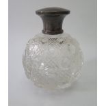 A George V Silver and Cut Glass Scent Bottle, 10 cm high, Birmingham 1928