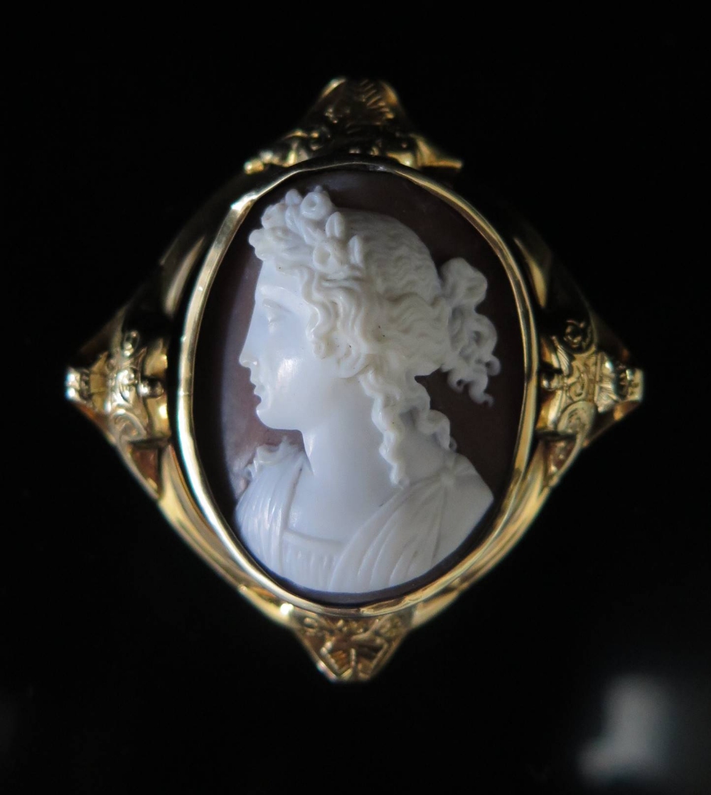 A Victorian Shell Cameo Brooch decorated with classical female bust in precious yellow metal