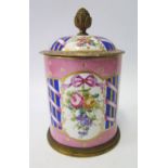 A French Sevres Porcelain Pot with Cover the pink ground decorated with floral and bow reserves