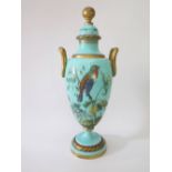 A Nineteenth Century Turquoise Glass Vase with cover decorated with a hand painted bird in enamels