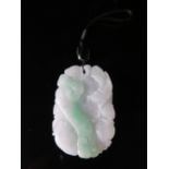 A Carved Jadeite Pendant carved with birds, c. 68 mm