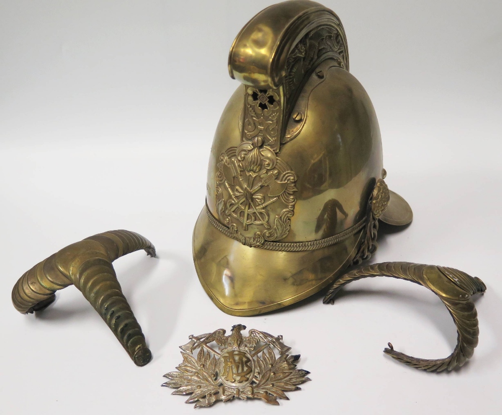 A Merryweather Brass Fireman's Helmet, pair of epaulets and badge