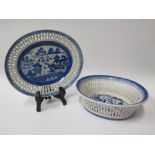 A Nineteenth Century Chinese Blue and White Oval Bowl with pierced rim and matching saucer 24 cm.