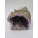 An Amethyst Geode with miniature mining scene, 25 cm high