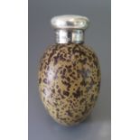 A Victorian Silver Mounted Scent Flask in the form of an egg painted with a mottled brown on a light