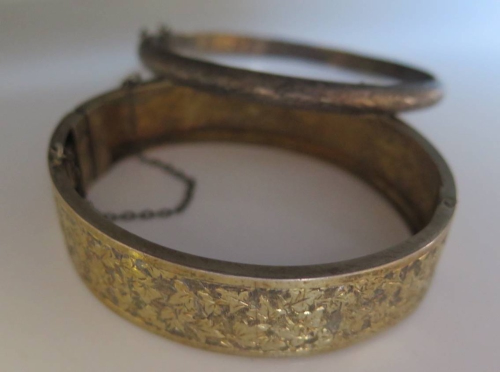 A Silver Gilt Hinged Bangle and one other