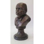 A Bronze Bust of Winston S. Churchill on a marble base, 32 cm