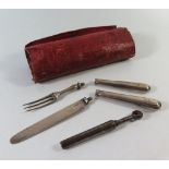 A Georgian Silver Travelling Knife and fork and steel corkscrew in a leather wrap