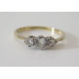 A Three Stone Diamond Ring in platinum and precious yellow metal setting, size R, 2.8 g