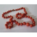 A Graduated Coral Bead Necklace, largest bead c. 10 mm, 43 cm, 26 g