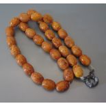 A Pressed Amber Bead Necklace, 66 g gross