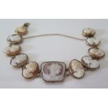 A Nineteenth Century Shell Cameo Bracelet in a precious yellow metal setting, set with eleven