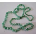 A Graduated Jade Bead Necklace, largest c. 10 mm, c. 82 cm long, 59 g