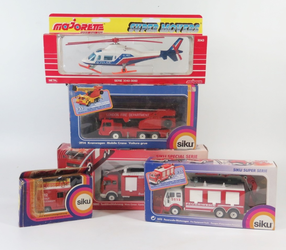 A Collection of Siku: 2914, 3880, 2213, 3512 and Majorette 3043, all boxed