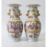 A Pair of Nineteenth Century Chinese Cantonese Vases, 23 cm. One damaged to rim