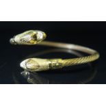 An Egyptian 21ct Gold Torque Bangle with serpent head finials, 35.7 g