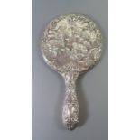 A Silver Backed Hand Mirror decorated with cherubs