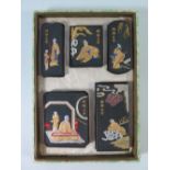 A Chinese Cased Set of Calligraphy Inks decorated with figures and characters. two with splits