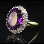 An 18ct Gold, Amethyst and Diamond Ring, size J.5, 4.7 g