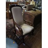 A Mahogany Framed Upholstered Open Arm Rocking Chair