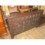 An Eighteenth Century Carved Oak Coffer