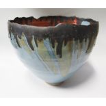 A Large Studio Pottery Vessel with light blue and burnt orange glazes and gold splash highlights,